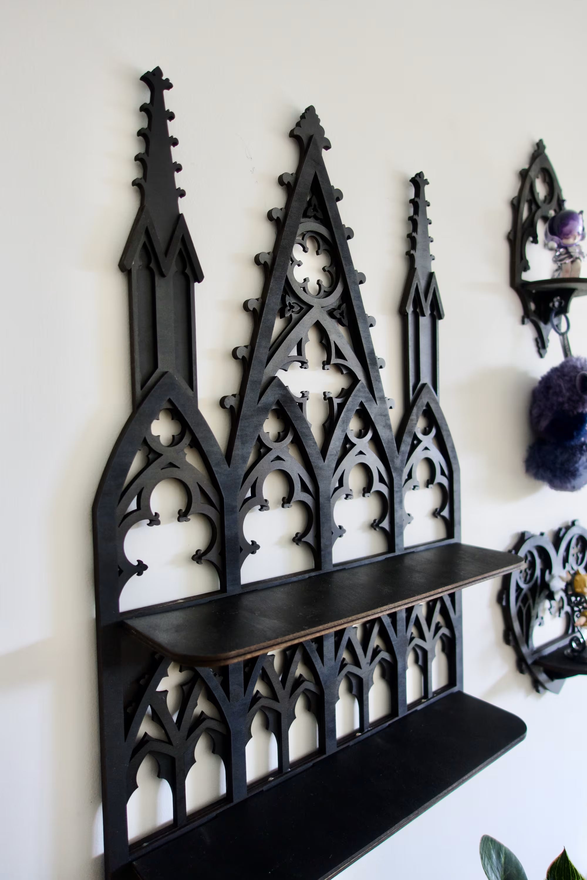 Dark academia wall shelf with gothic tracery — elegant display for books, mini statues, or curiosities.