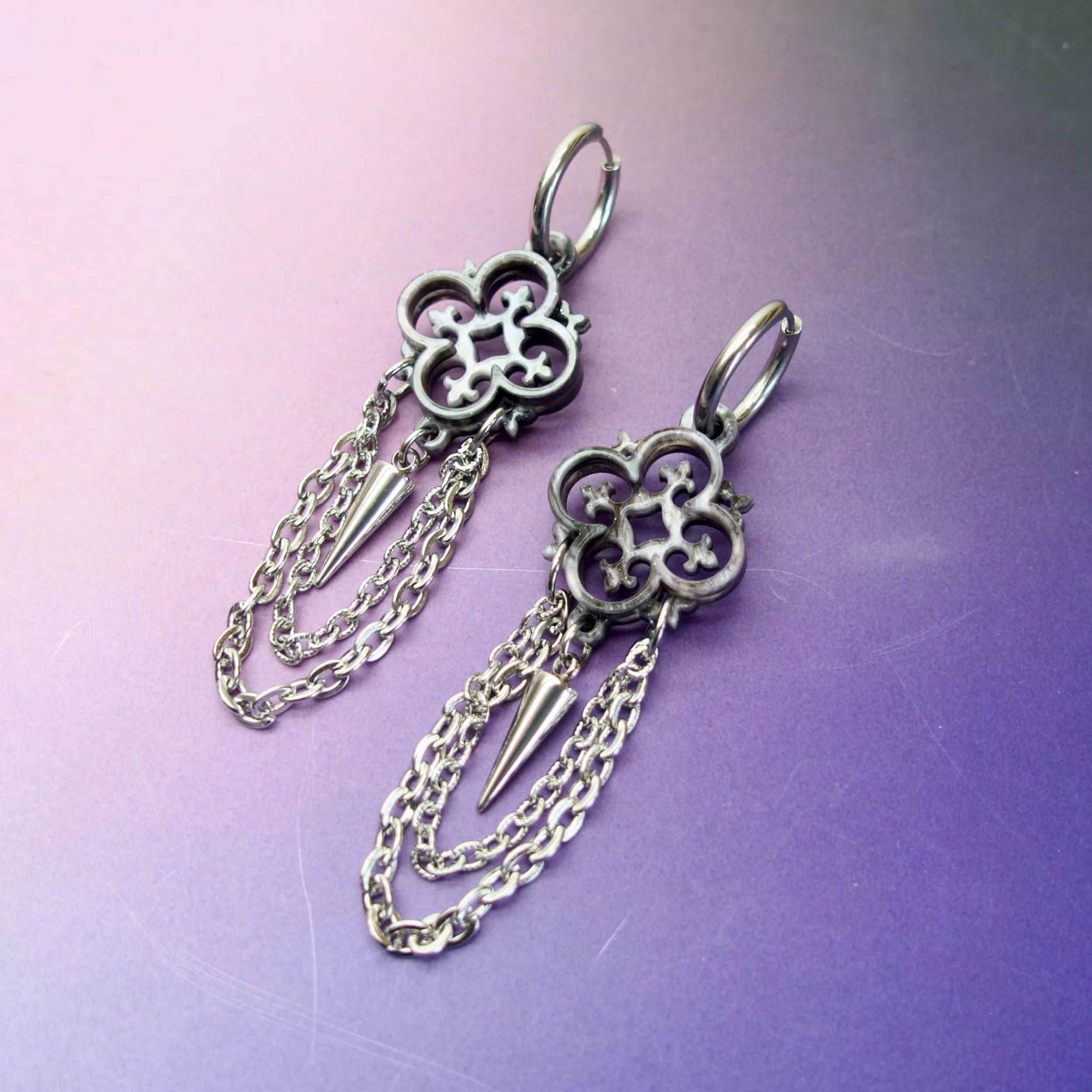 Gothic cathedral quatrefoil earrings with stainless steel chains and spikes — silver marbled acrylic alternative jewellery