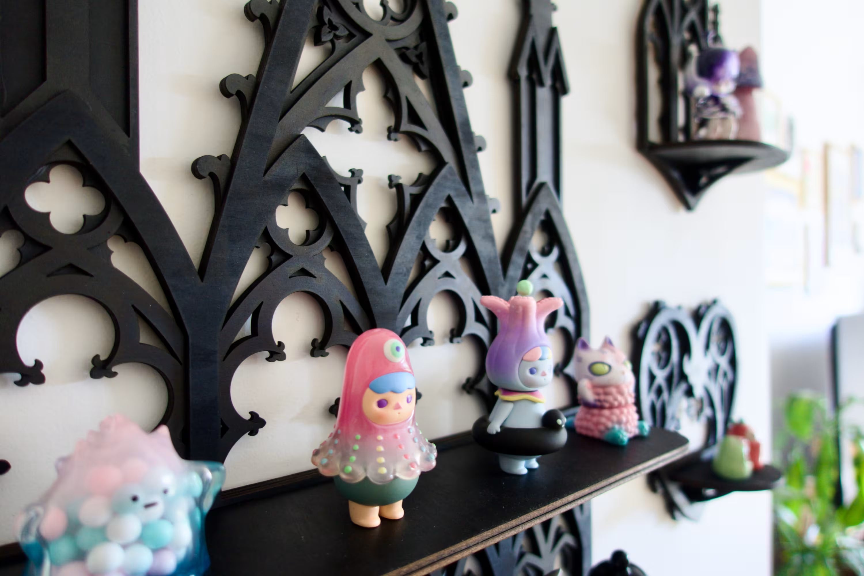 Gothic architecture-inspired home shelf — intricate black display with cathedral arches and towers.